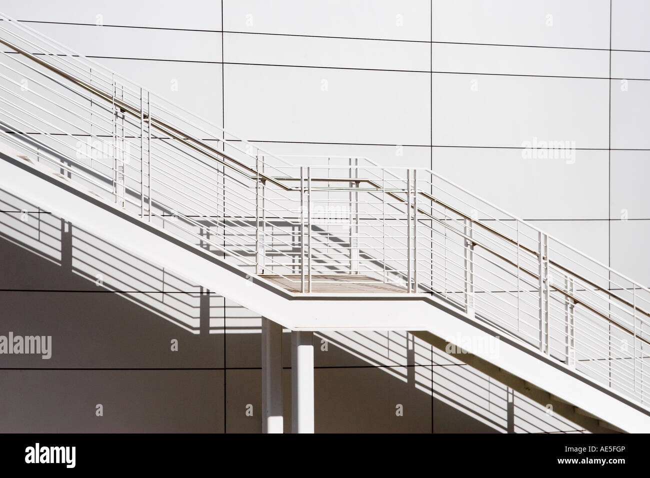 Exterior white stairs and railing on outside of white rotunda of San