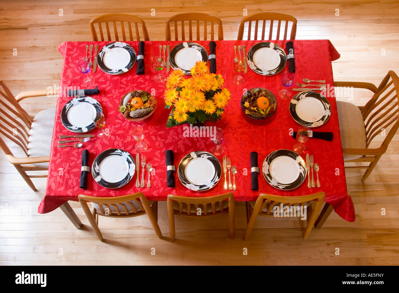 Aerial View Of Dining Room Table Place Settings With Red Tablecloth 