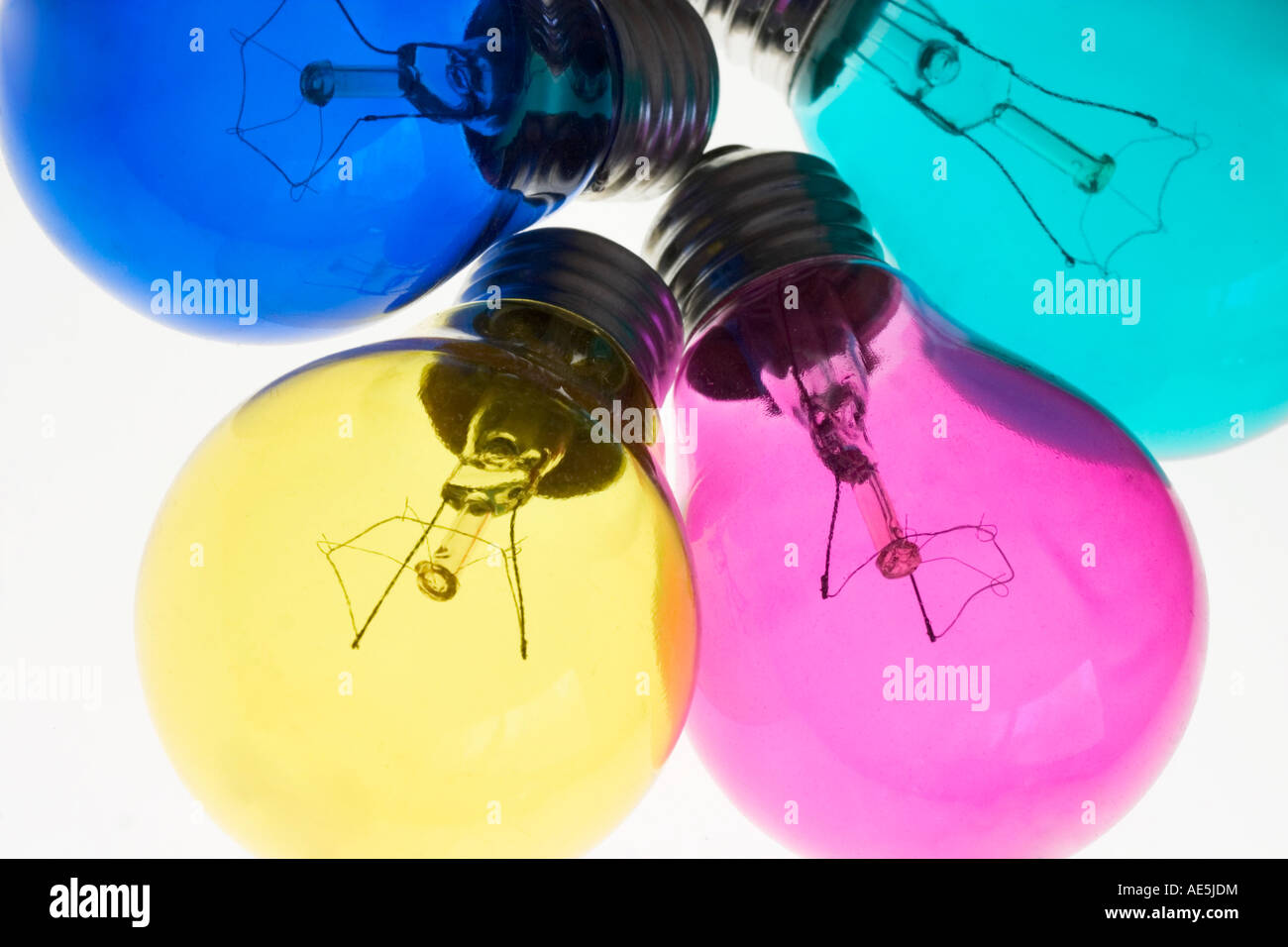 Red green yellow and blue light bulbs with filaments suggesting the