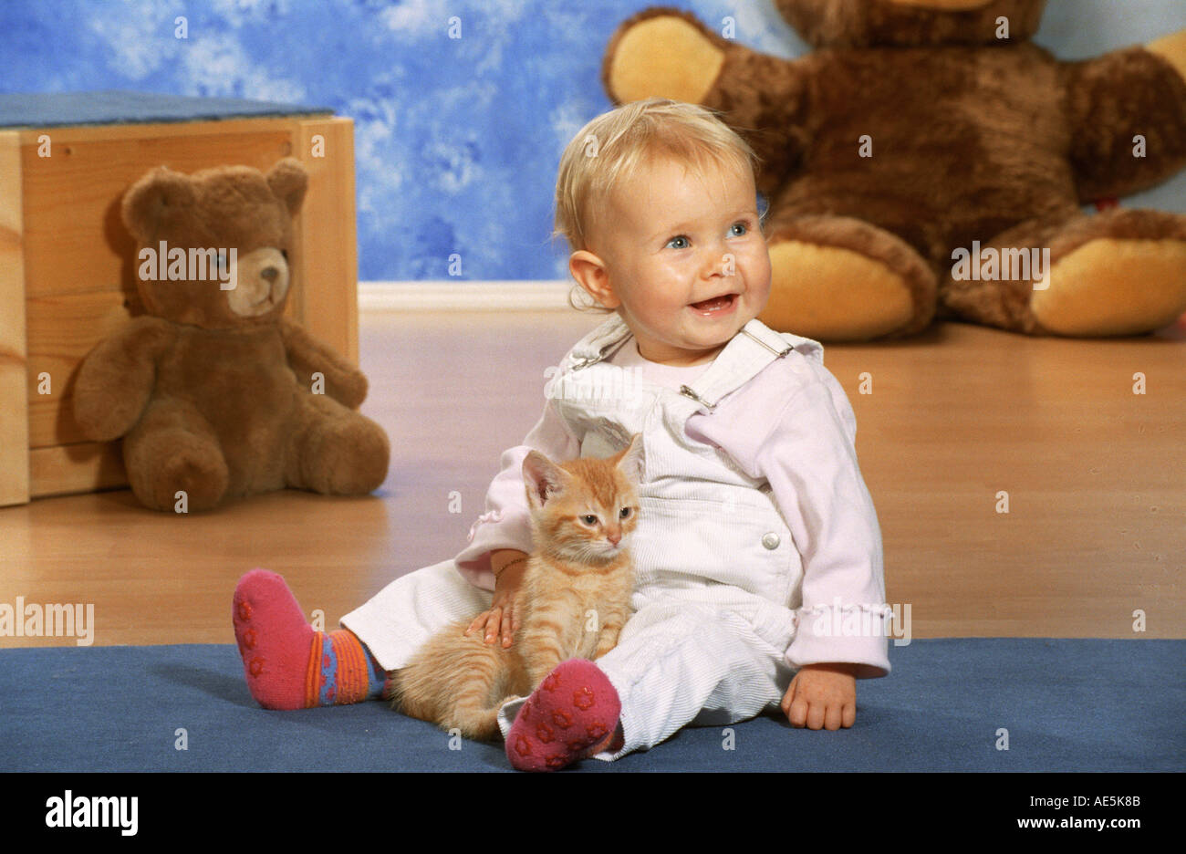 child with kitten Stock Photo