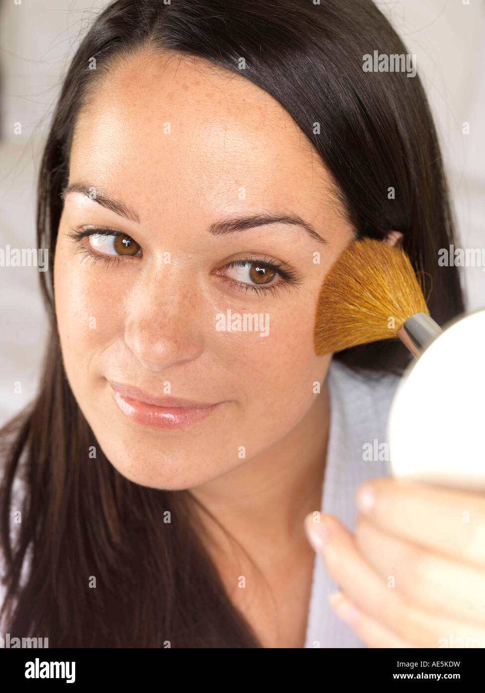 Young Woman Applying Blusher Model Released Stock Photo