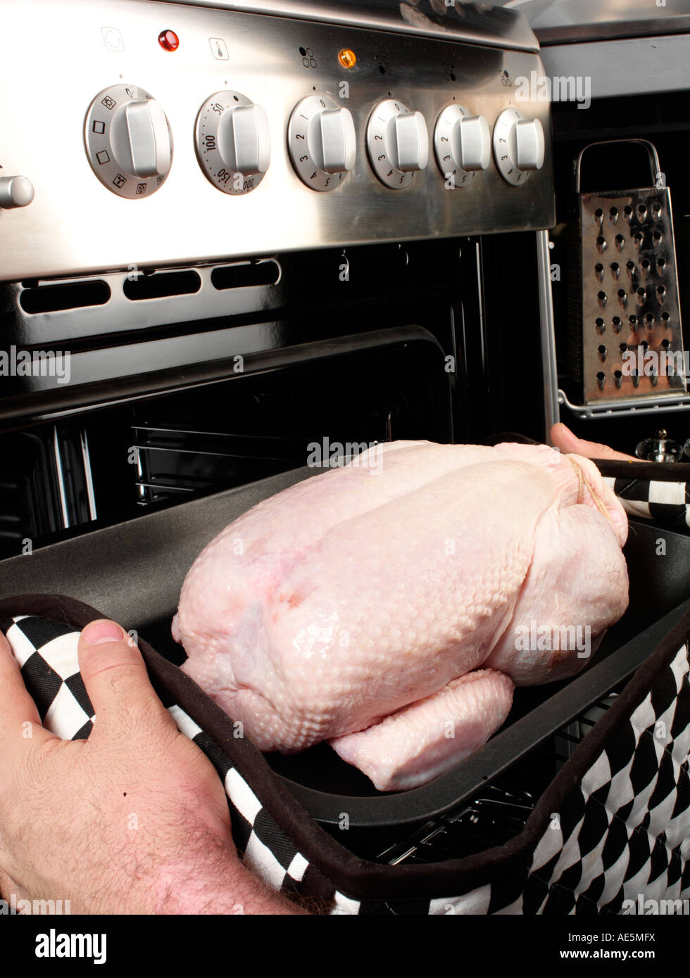 MAN ROASTING CHICKEN Stock Photo Alamy
