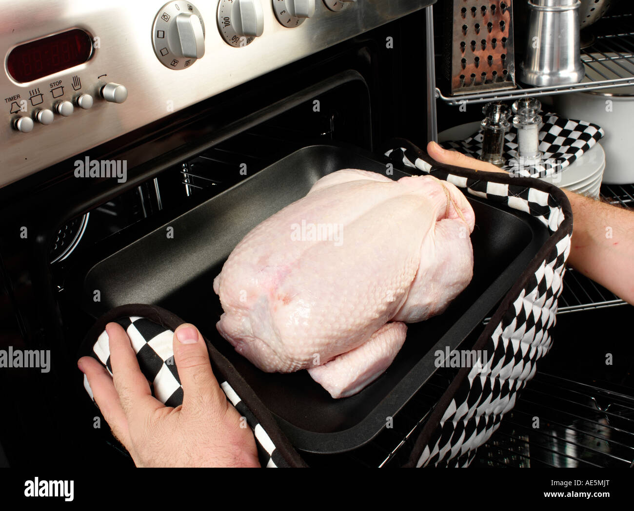 MAN ROASTING CHICKEN Stock Photo Alamy