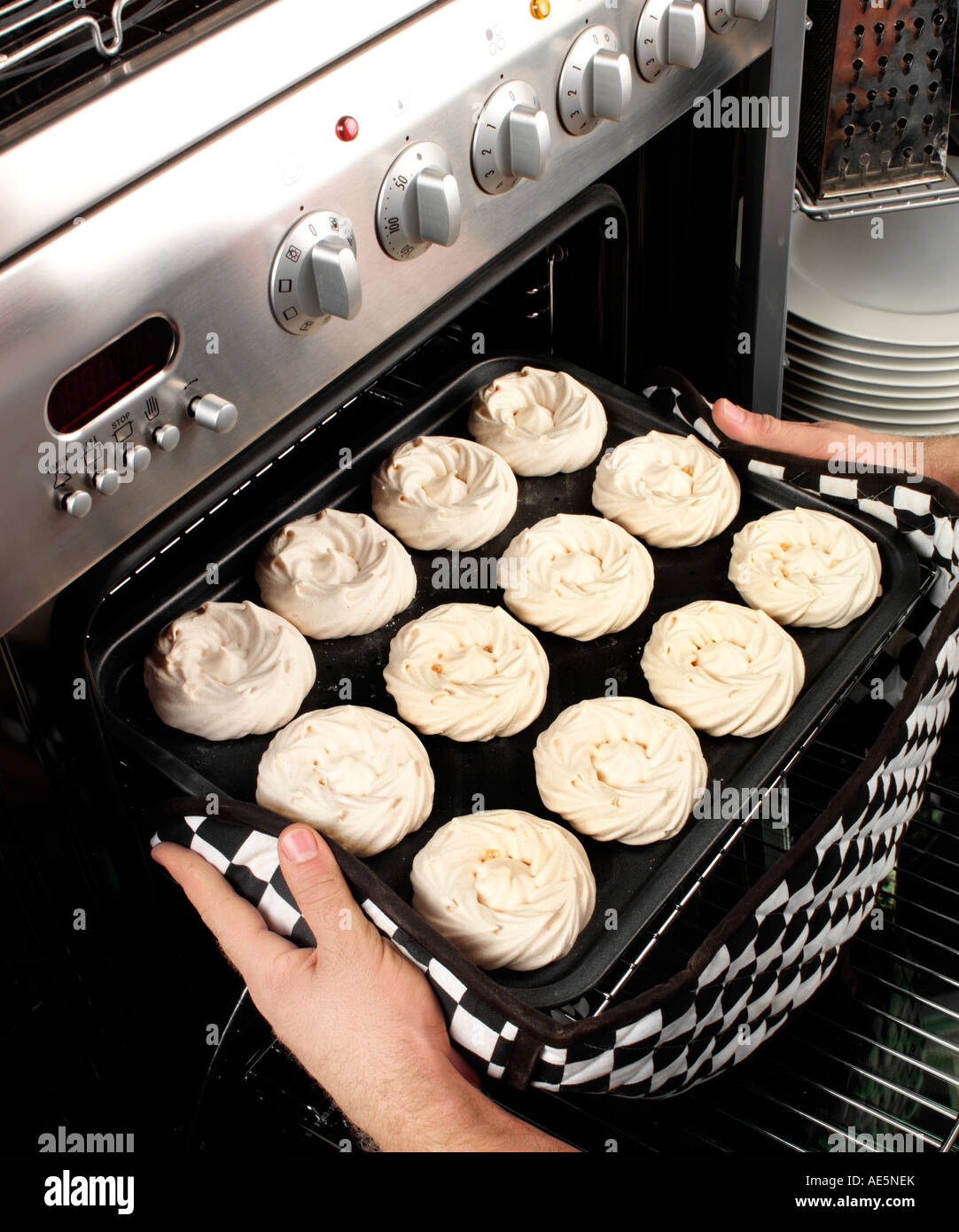 MAN BAKING MERINGUES Stock Photo Alamy