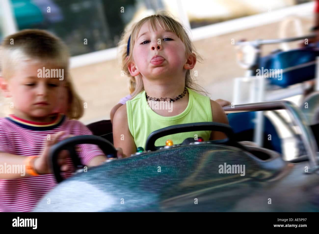 Kids on carnival ride Stock Photo - Alamy