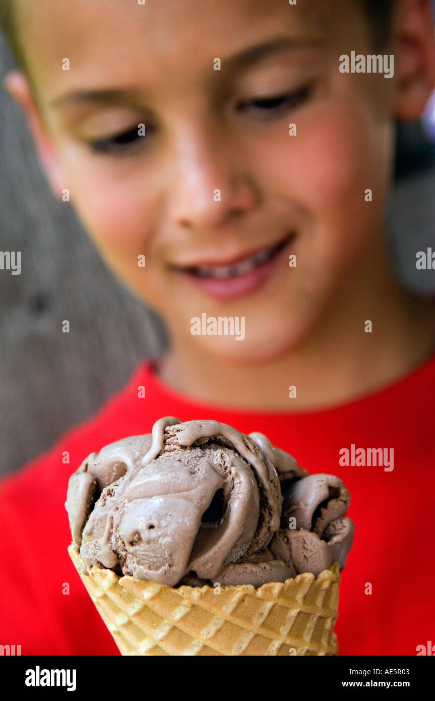 Boy eating ice cream cone Stock Photo Alamy