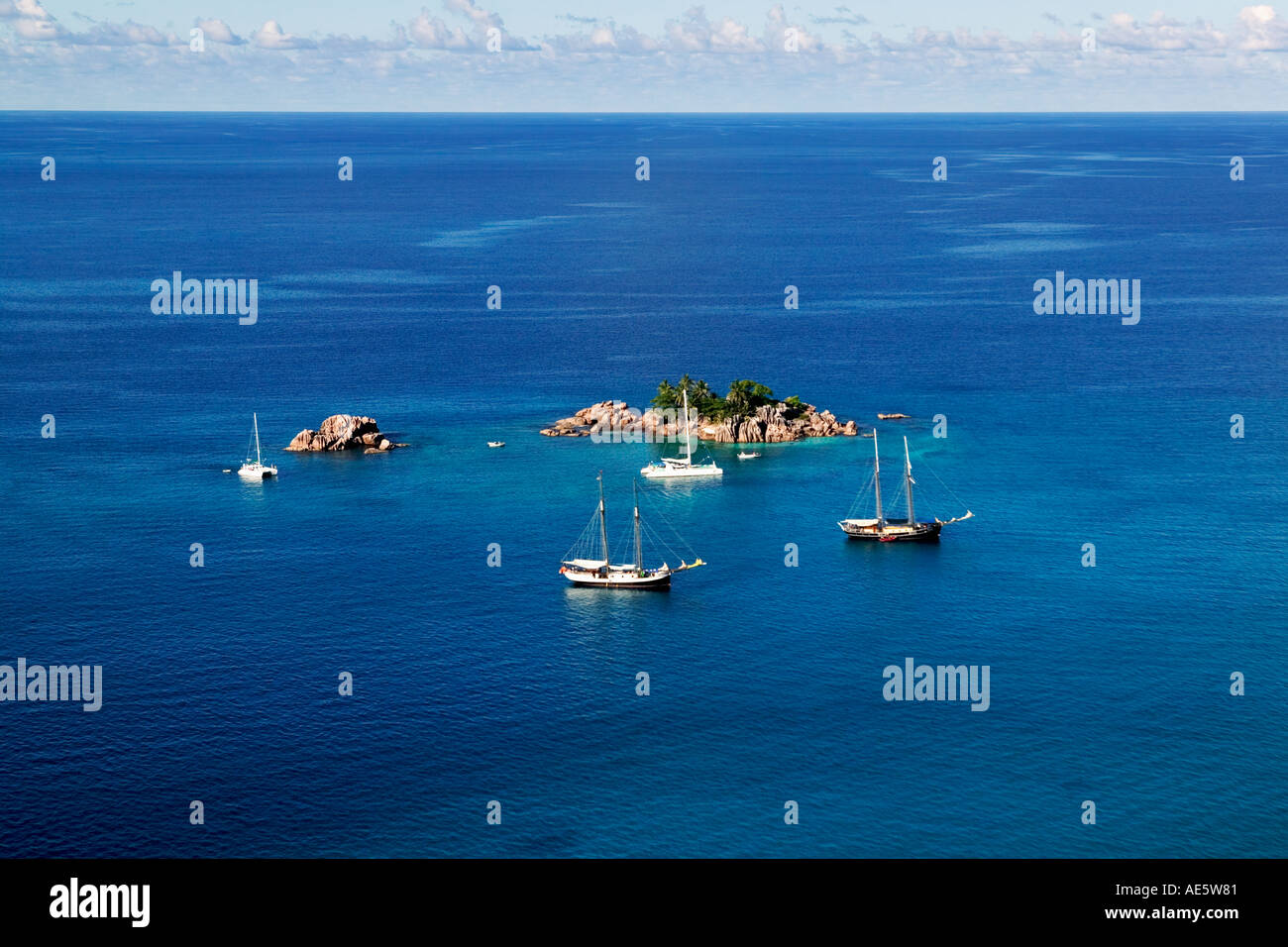 Aerial view of Saint Pierre Islet with sailing boats off the coast of Praslin Island Seychelles Stock Photo