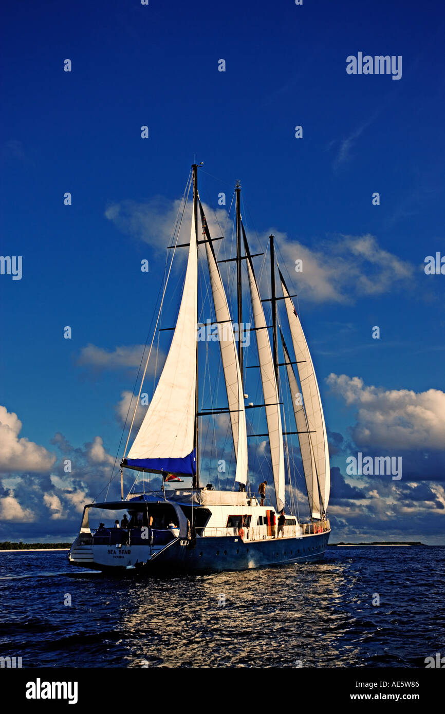 Yacht with full sails Sea Star Sailing Yacht Property released Seychelles Stock Photo