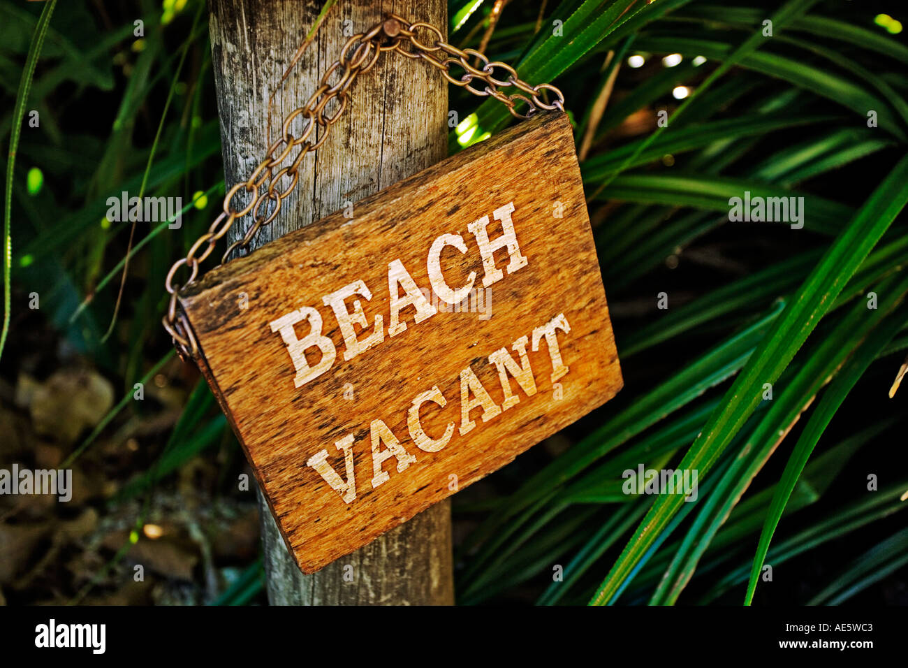 Beach vacant occupied sign on exclusive beach to ensure complete privacy Property released Fregate Island Seychelles Stock Photo