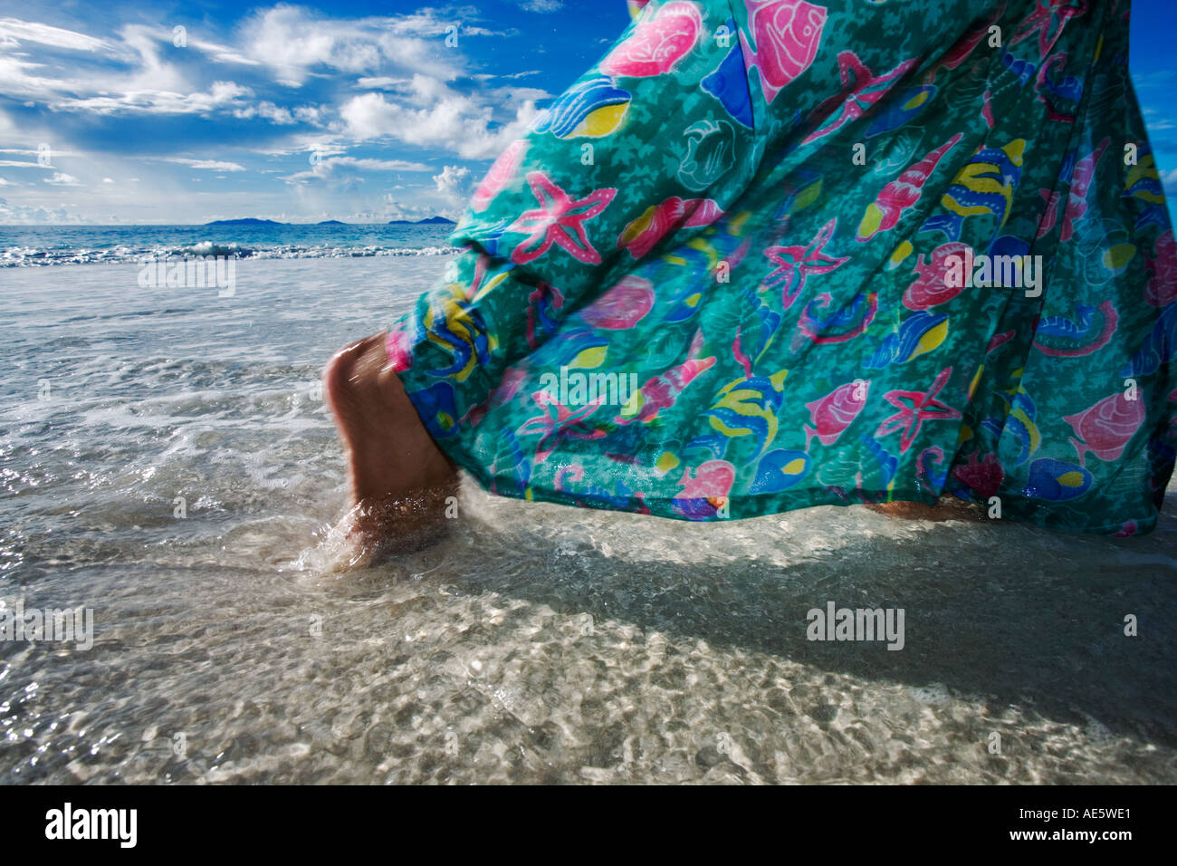 Woman walking on beach Model released Fregate Island Seychelles Stock Photo