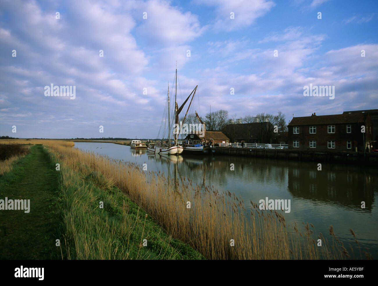 Sailing barges moored on The River Alde by the converted Maltings five miles inland from Aldeburgh Suffolk Stock Photo
