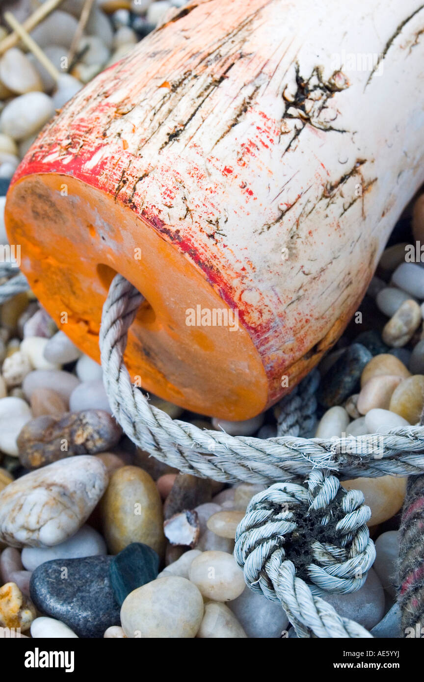 Lobster float washed up on a cobbled beach Stock Photo