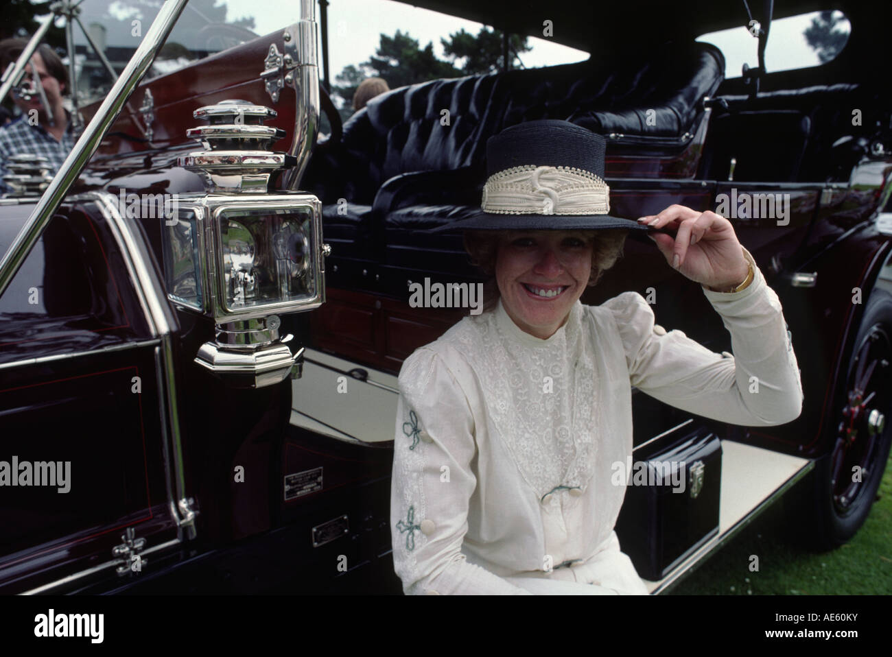 Owner in costume with 1909 WELCH MODEL 4 0 CLOSE COUPLED TOURING CAR at the CONCOURSE D ELEGANCE PEBBLE BEACH CALIFORNIA Stock Photo