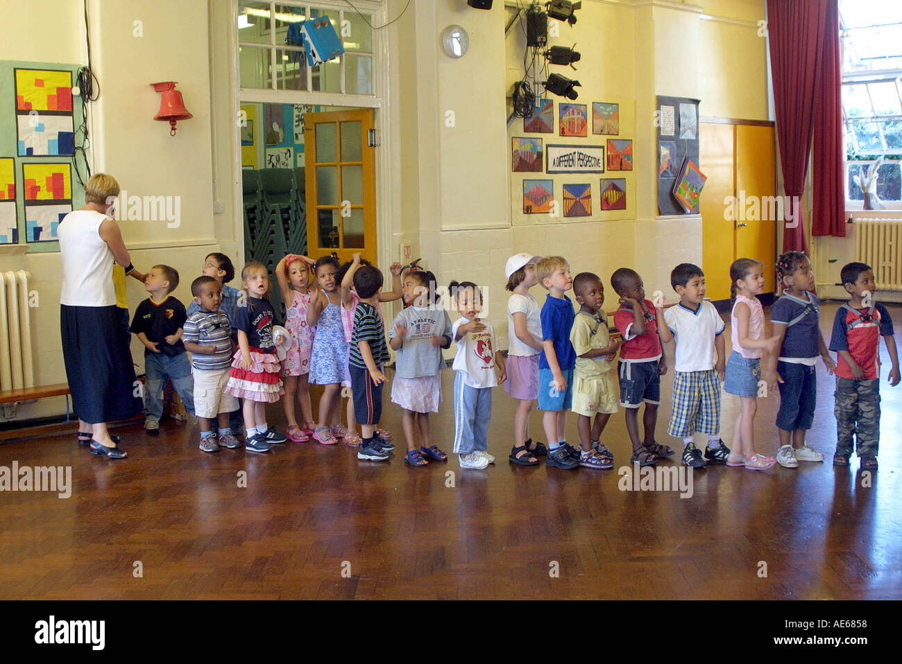 Nursery children lining up in school hall Stock Photo