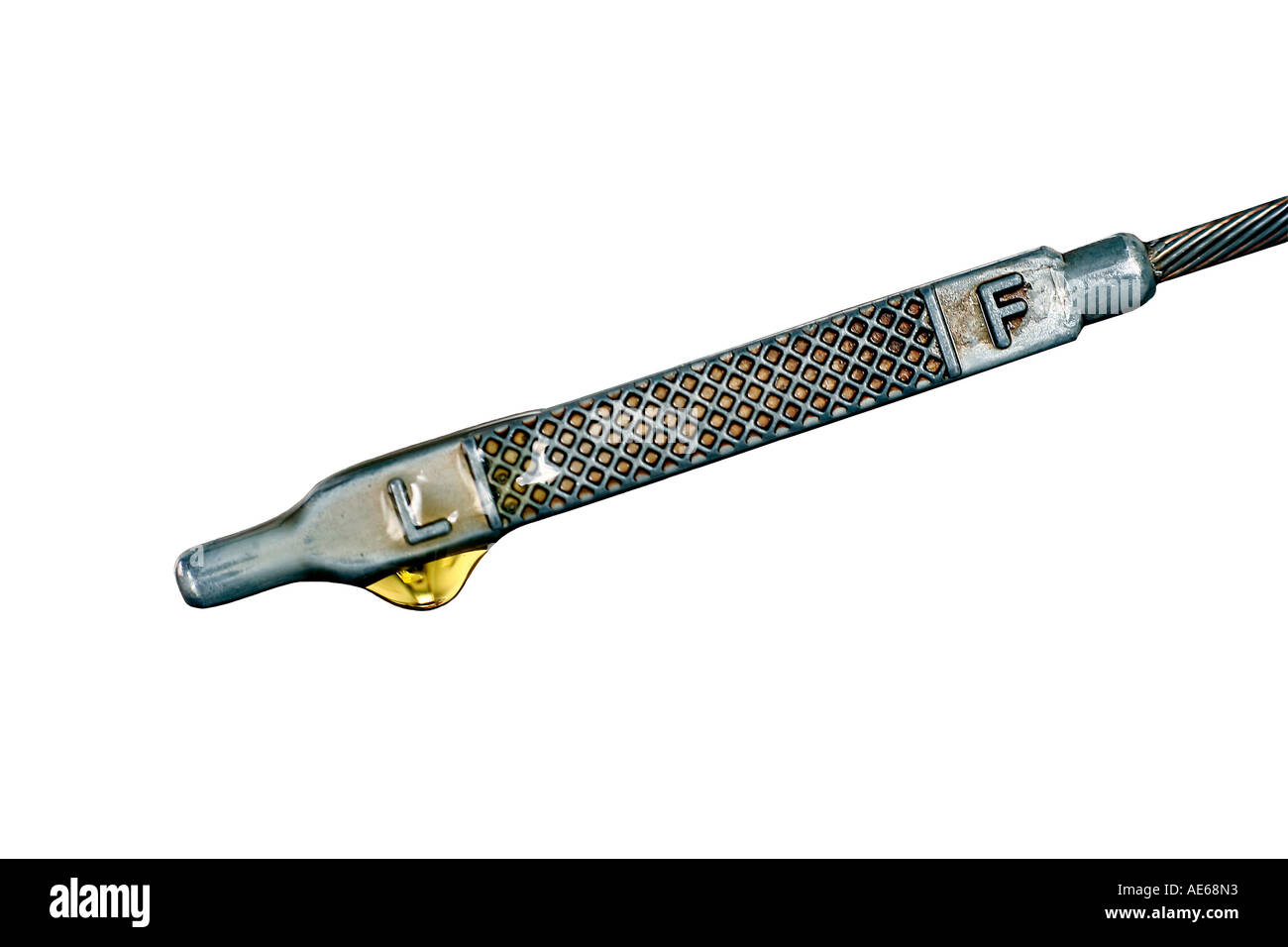 macro engine oil on a fuel dip stick for oil level control cut out