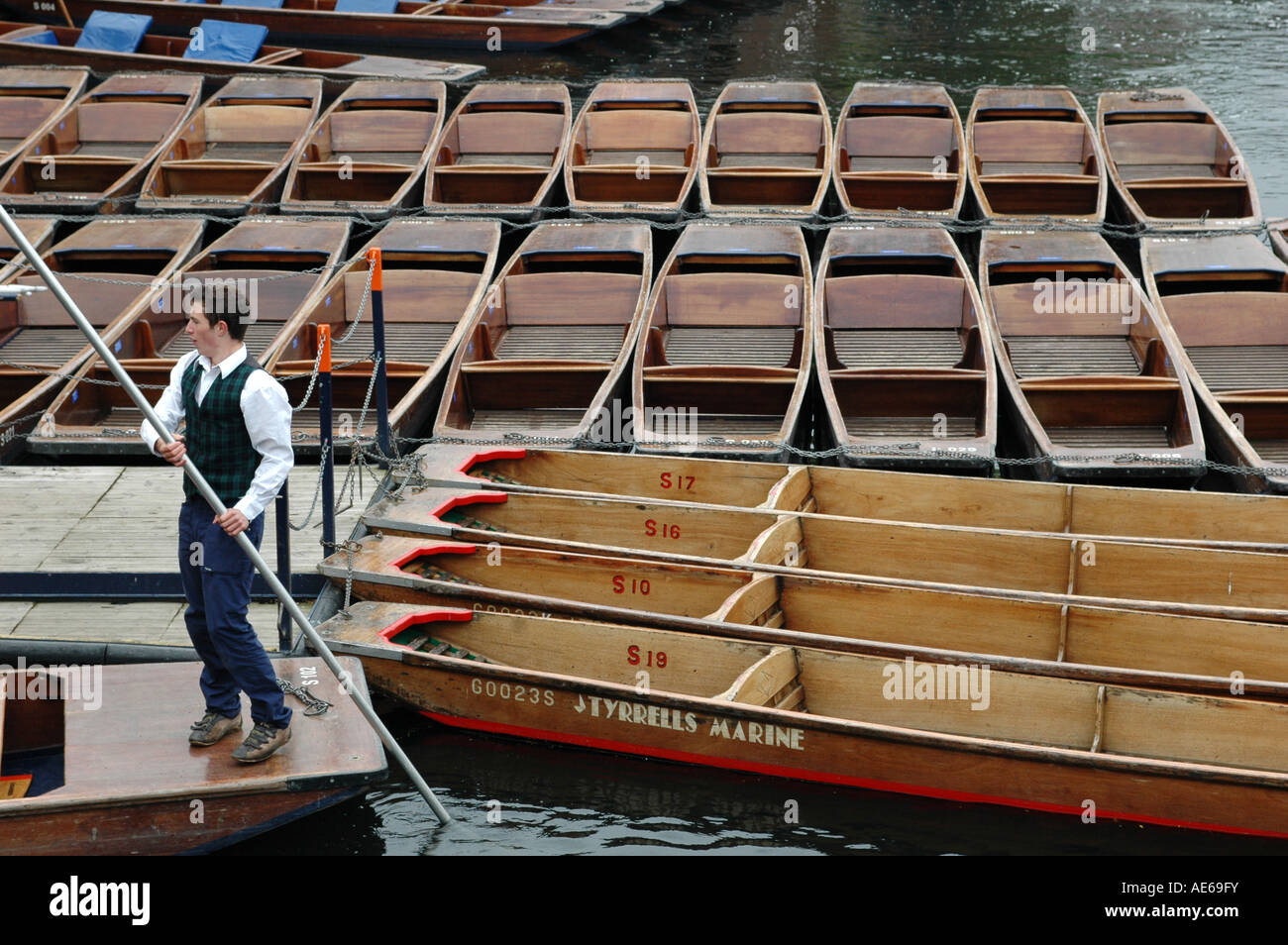 Punter with punts on the Cam river, England Stock Photo