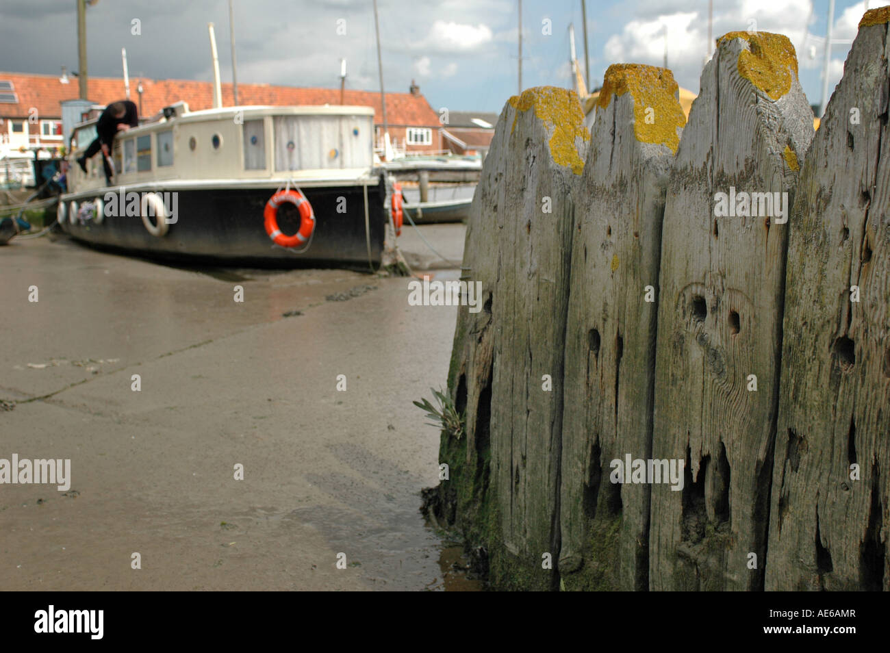 Boats stuck in mud on a low tide Stock Photo
