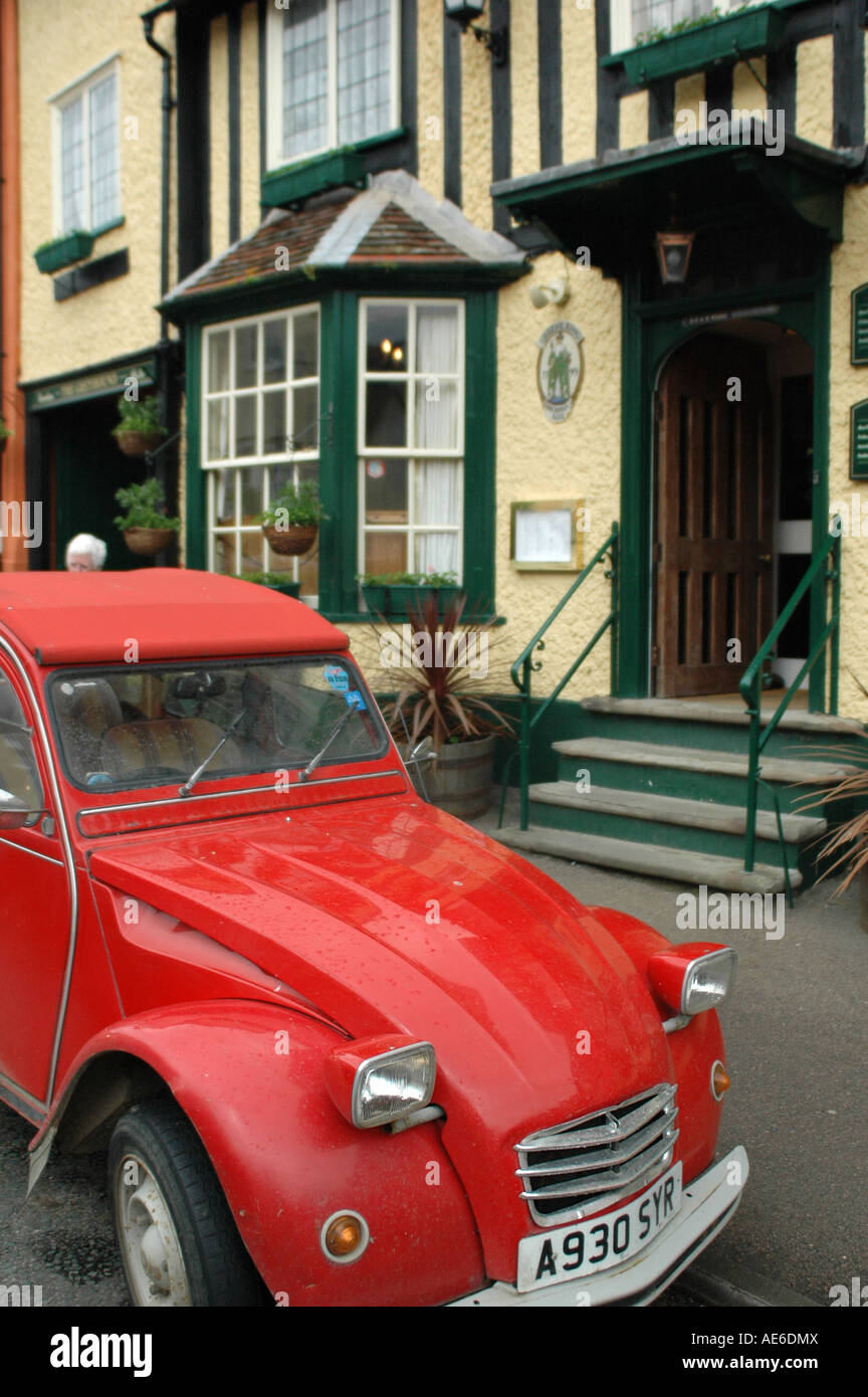 Red car in front of a country pub Stock Photo