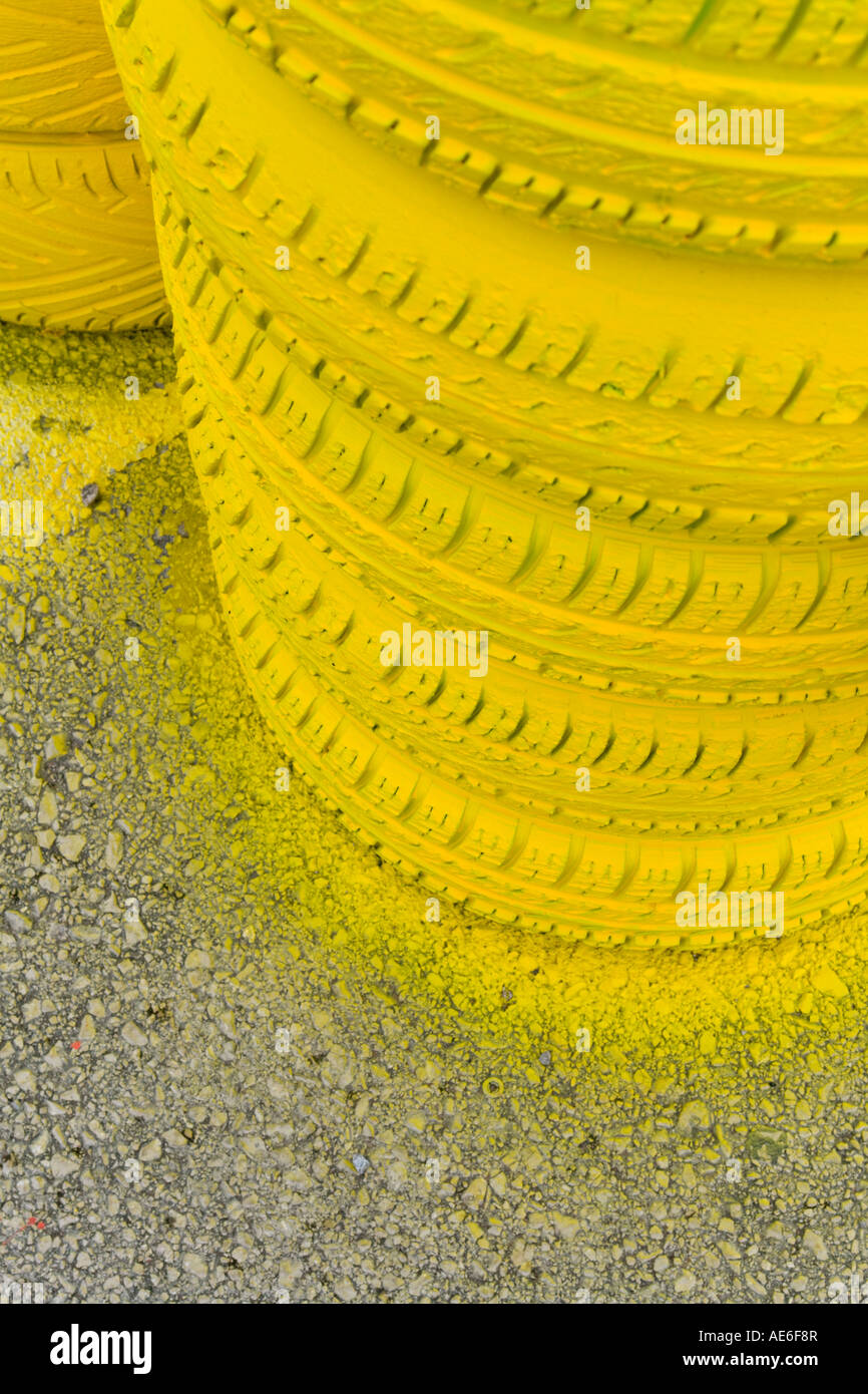 Bright yellow color rubber tires stacked on road Stock Photo Alamy