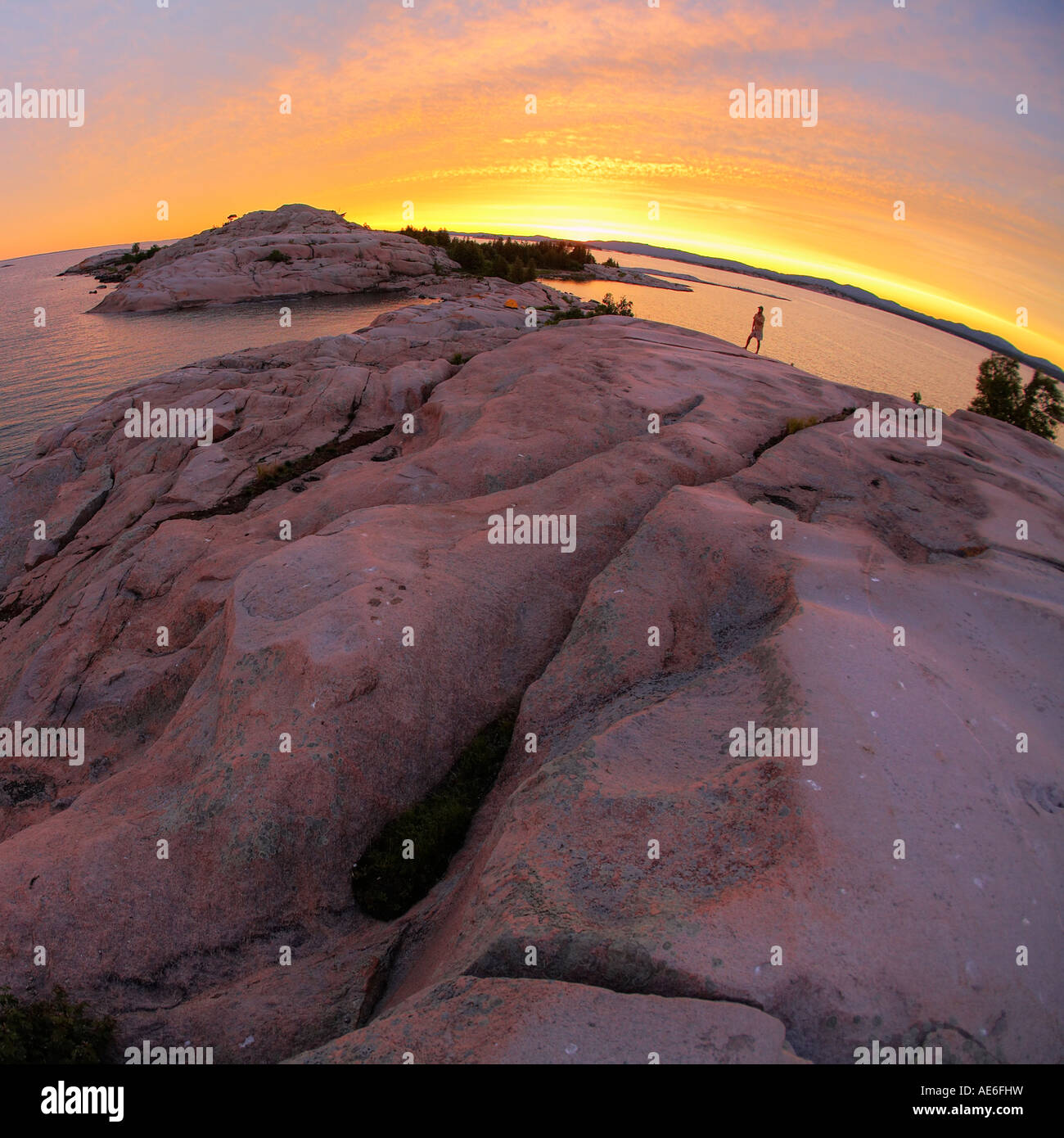 Man watching sunset Georgian Bay Ontario Canada Stock Photo