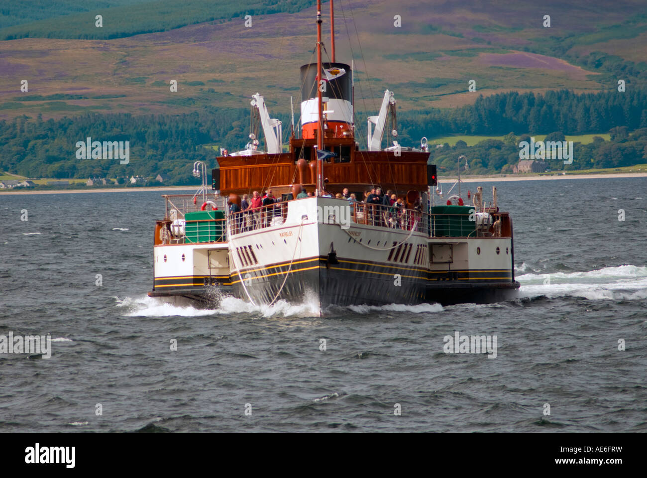 Paddle Steamer Waverley approaching Lochranza pier on the Isle of Arran, Scotland. Heather on