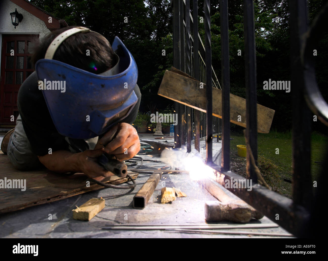 blacksmith welding wrought iron work sparks spatter Stock Photo Alamy