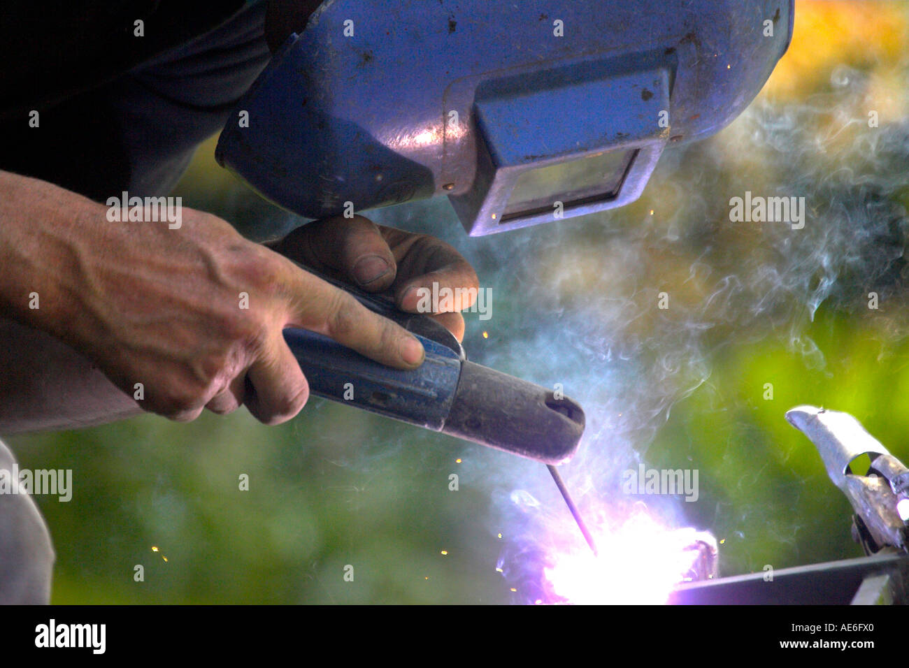 blacksmith welding wrought iron work sparks spatter Stock Photo Alamy