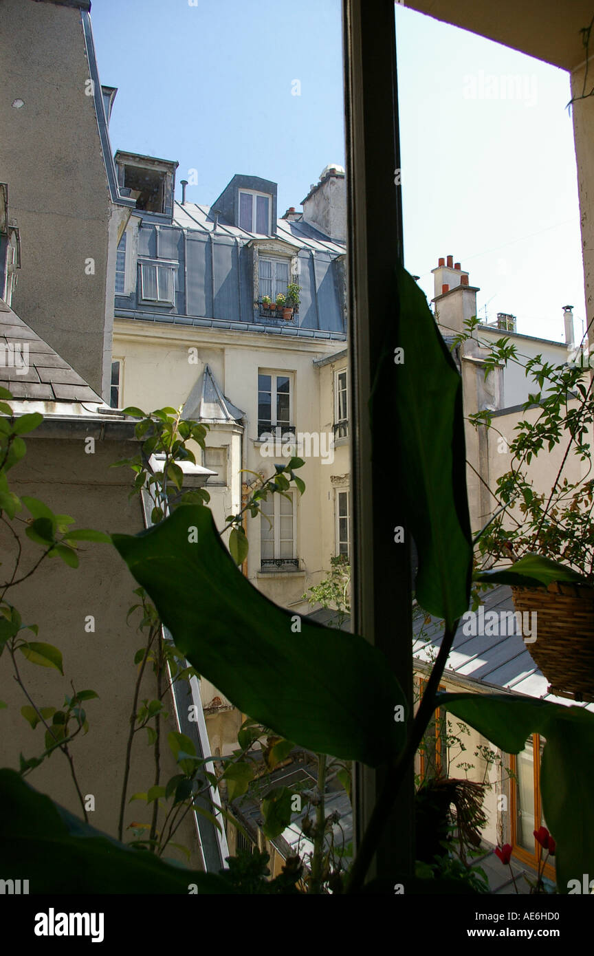 Parisian apartment view window rooftops Stock Photo