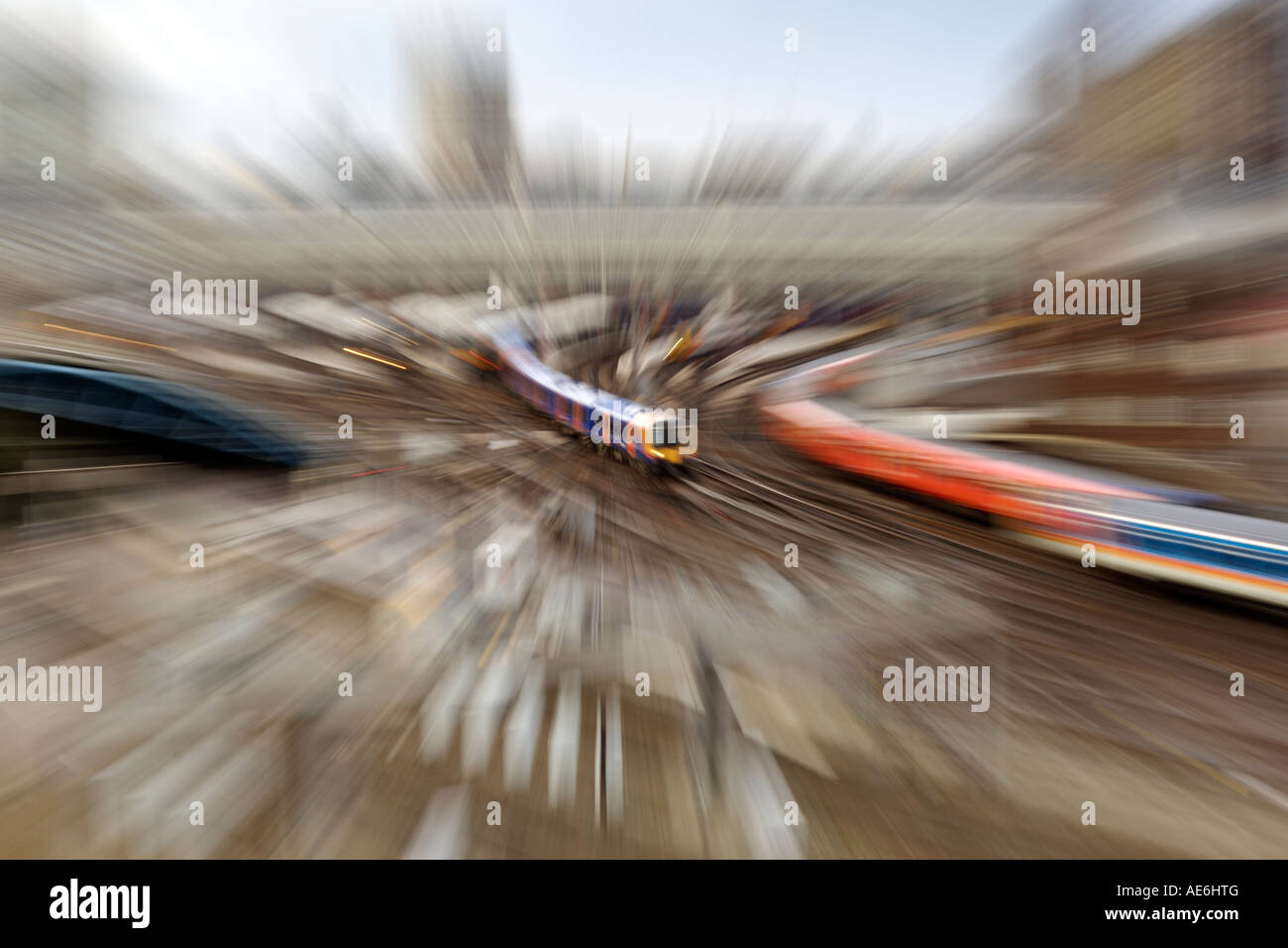 Zoom-blurred view of trains leaving London's Waterloo train station. Stock Photo