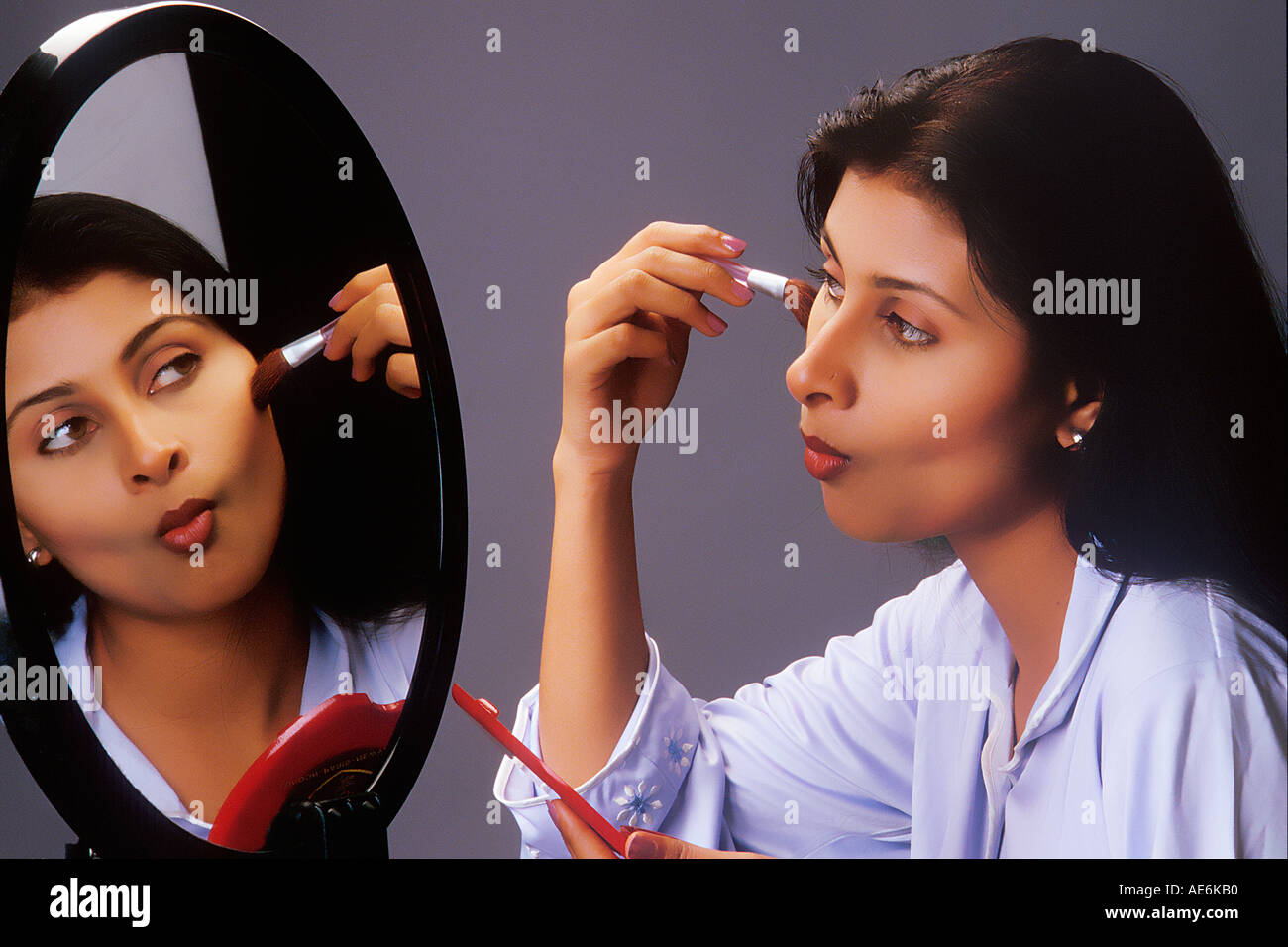 Asian woman applying beauty hi-res stock photography and images - Alamy