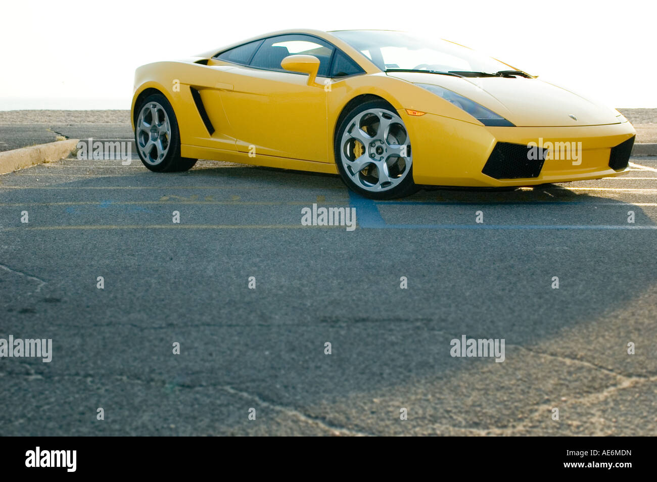 Exotic yellow sportscar, a symbol of success, wealth, speed, luxury, excess, flamboyance and desire Stock Photo