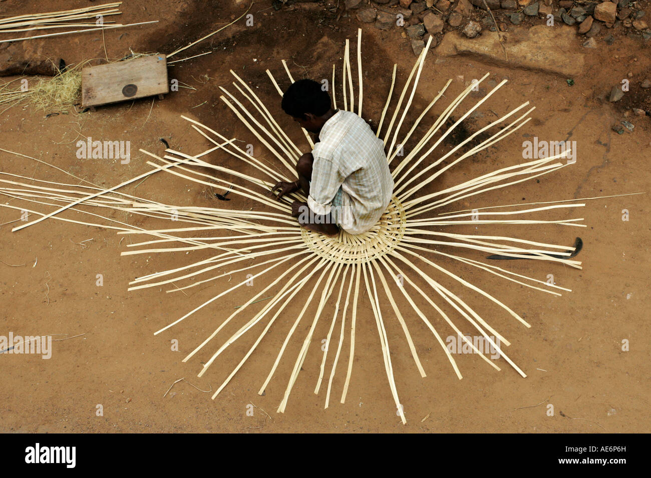 Indian man weaving basket Stock Photo