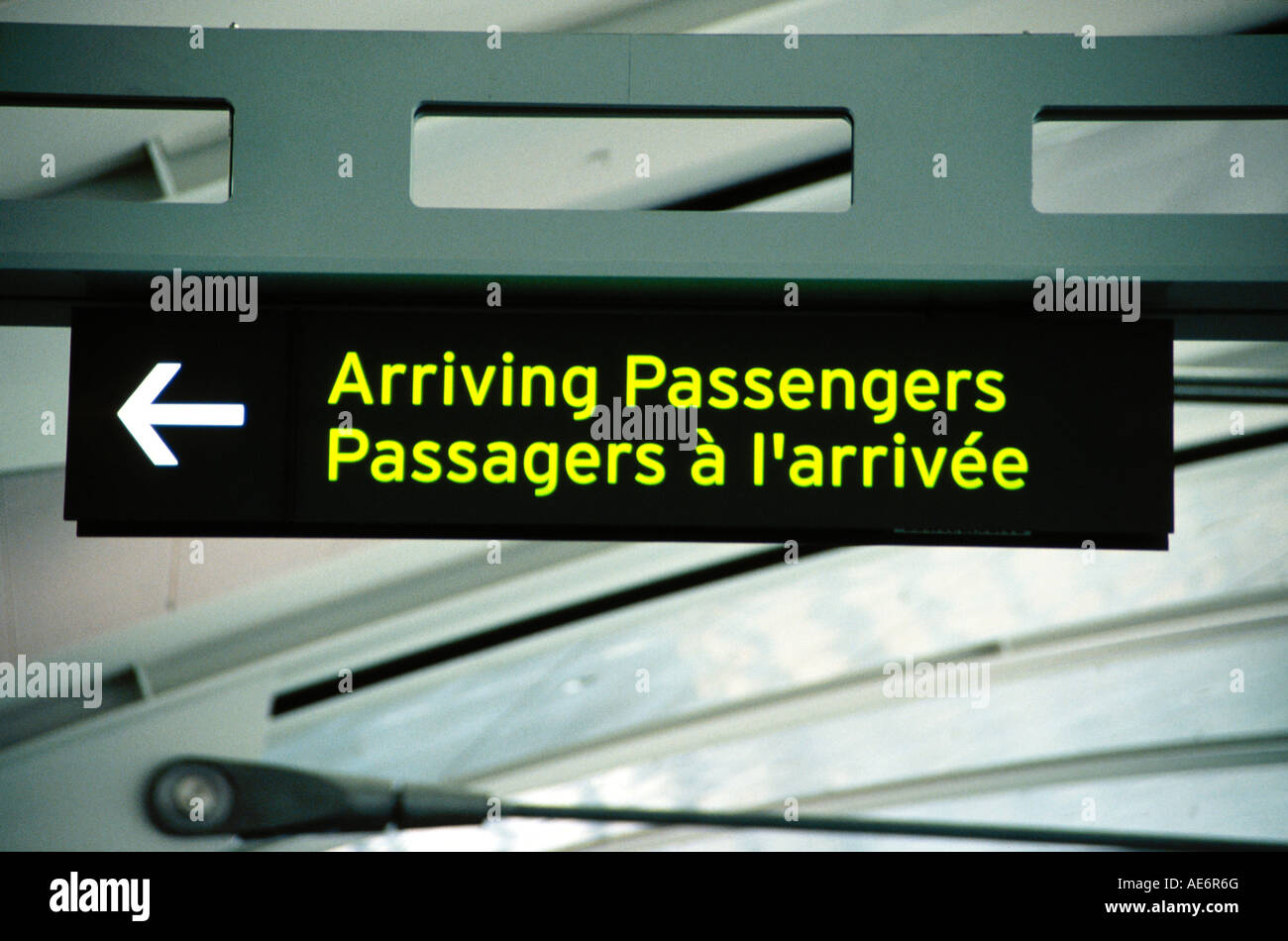 Arriving passengers sign in English & French Stock Photo