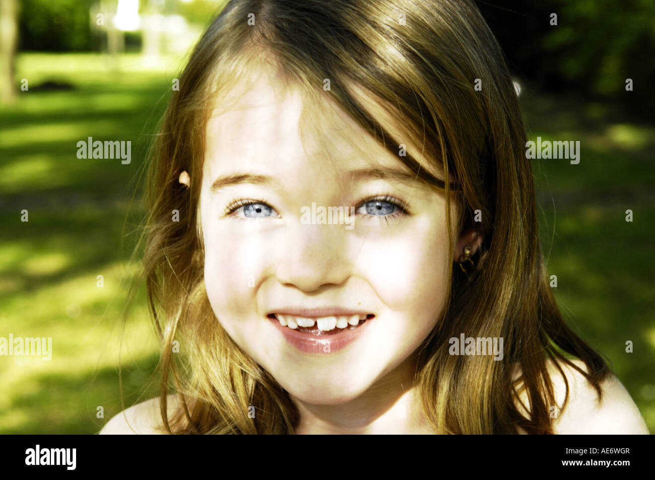 portrait head and shoulders girl child six seven happy positive colour