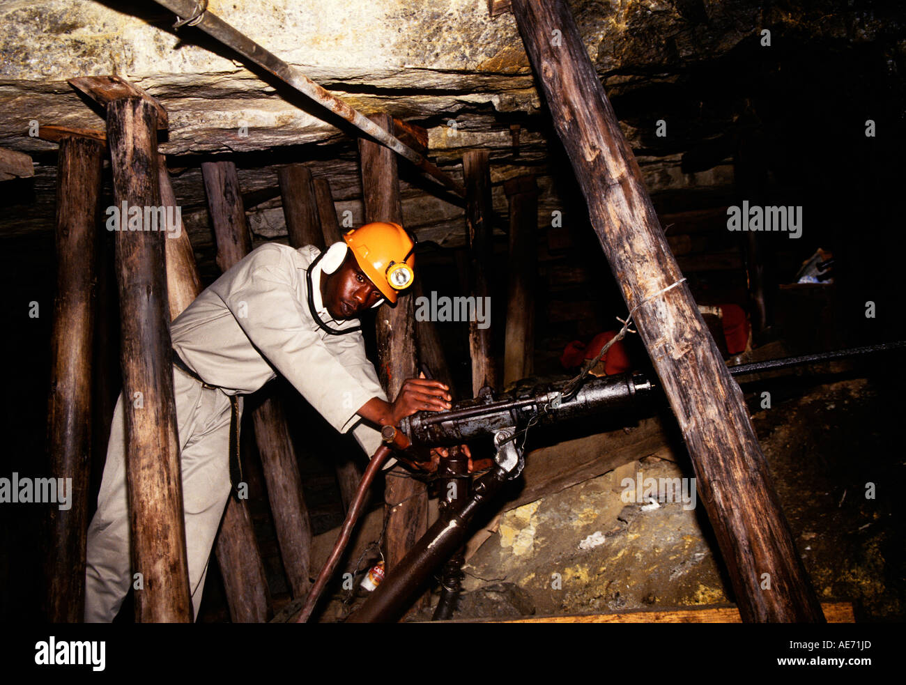 Mine worker in gold mine using jack hammer at Gold Reef City in Johannesburg, South Africa Stock Photo