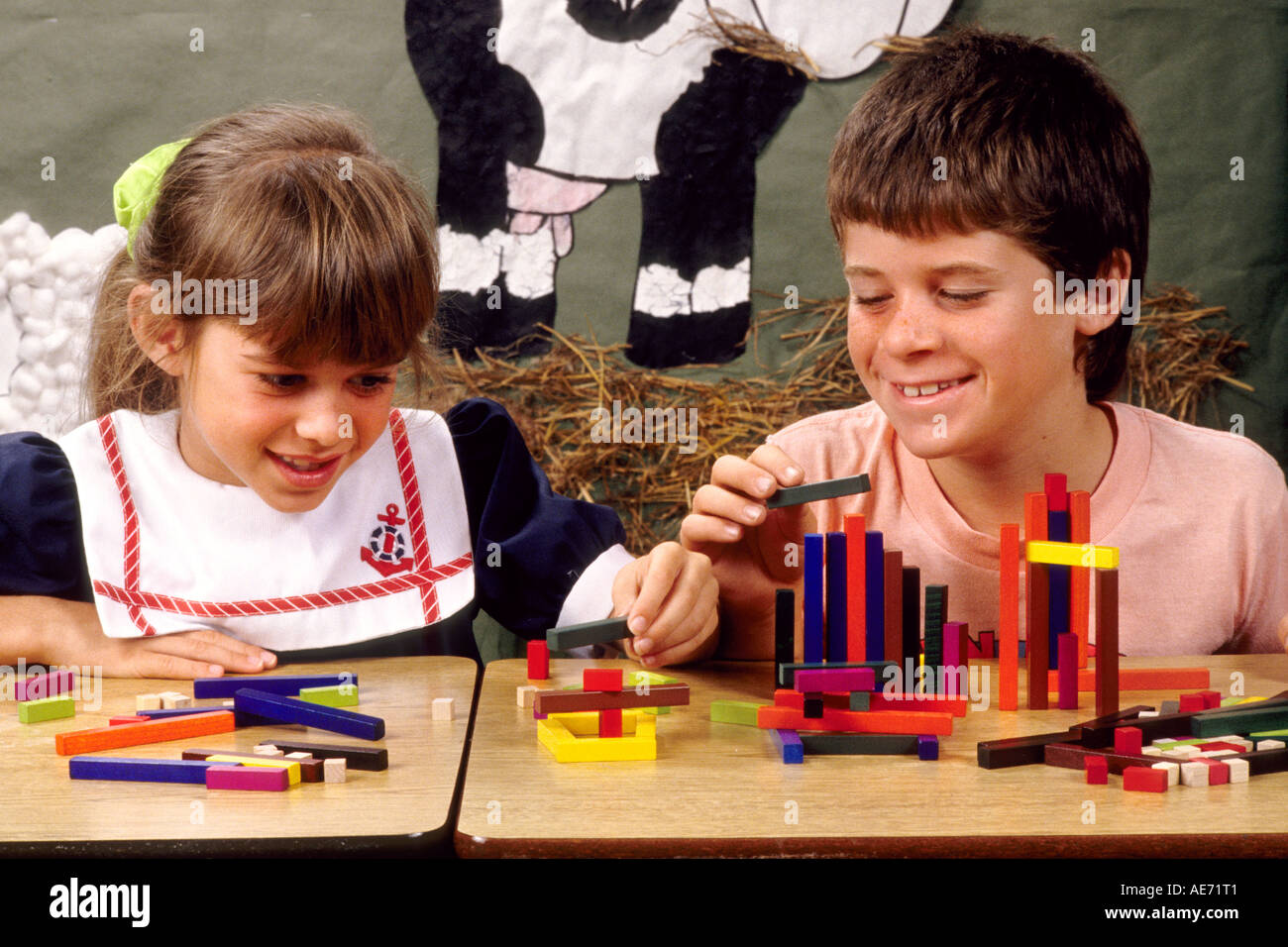 Students in first grade working together on block assignment in school Stock Photo