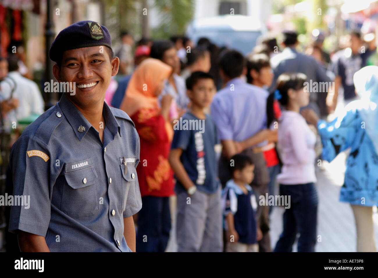 Malaysian Police Officers On Ji Carpenter, The Jalan Carpenter Street Market, Kuching, Sarawak, Borneo, Malaysia Stock Photo