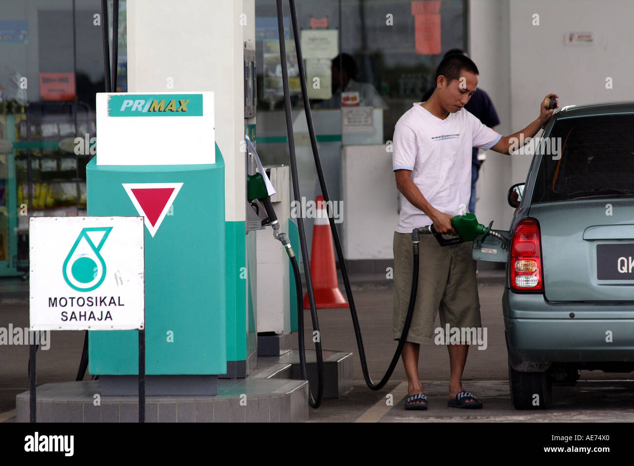 Gas Station Customer Filling up With Fuel in Kuching, Sarawak, Borneo, Malaysia Stock Photo