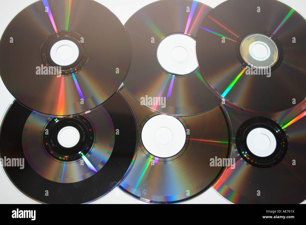 six compact discs  reflecting light. Photo by Willy Matheisl Stock Photo