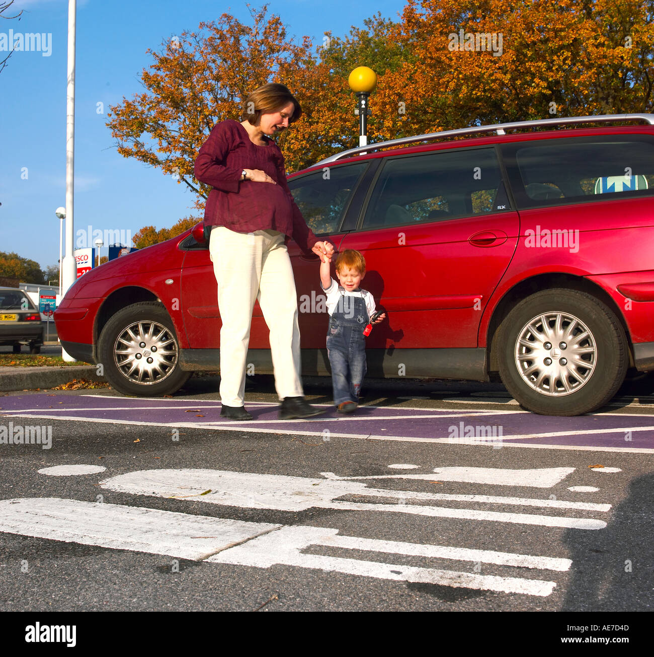 Pregnant Mother with small child and car Stock Photo