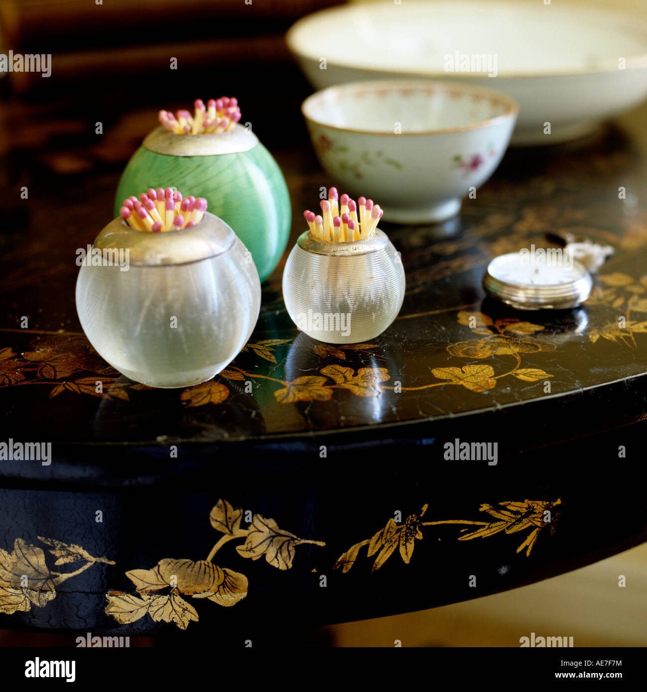 Vintage glass matchstick holder and pocket watch on lacquered tabletop Stock Photo Alamy