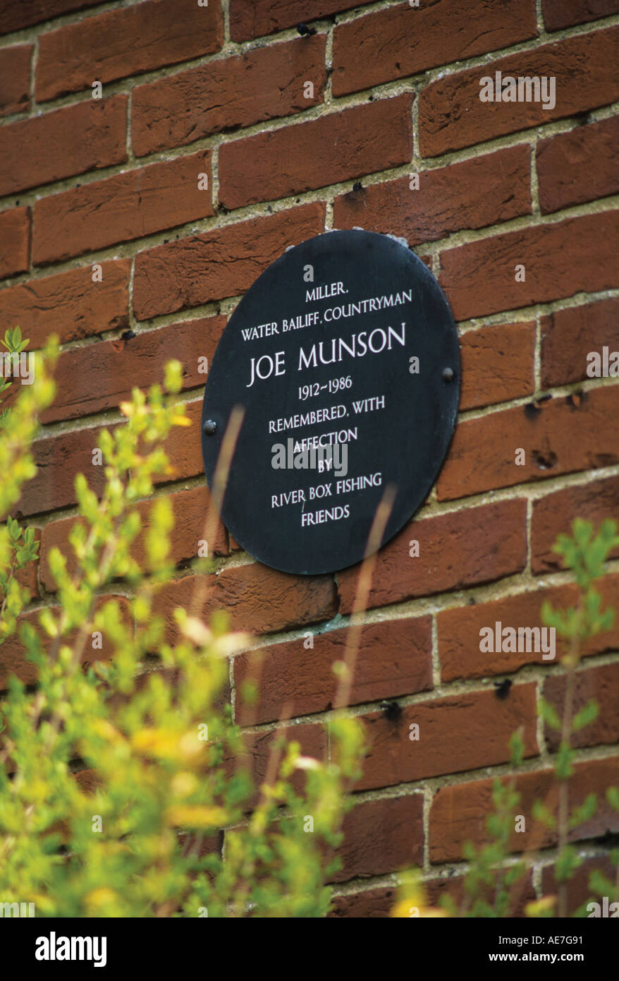 Plaque dedicated to Joe Munson who operated Thorington Mill on The River Box east of Stoke by Nayland Suffolk Stock Photo