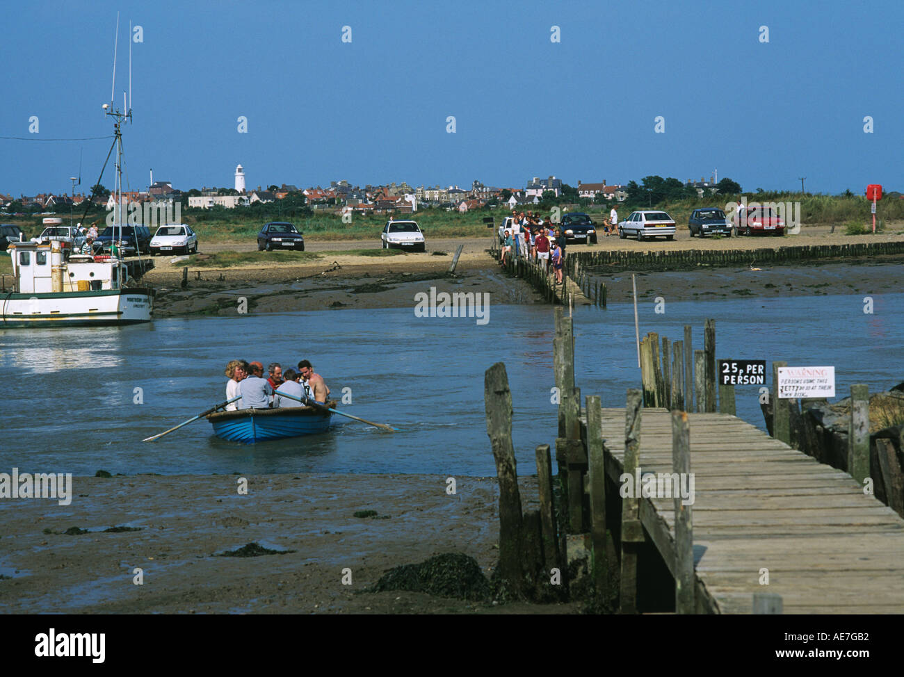 Small passenger ferry taking summer visitors across the River Blyth from Southwold to Walberswick Stock Photo