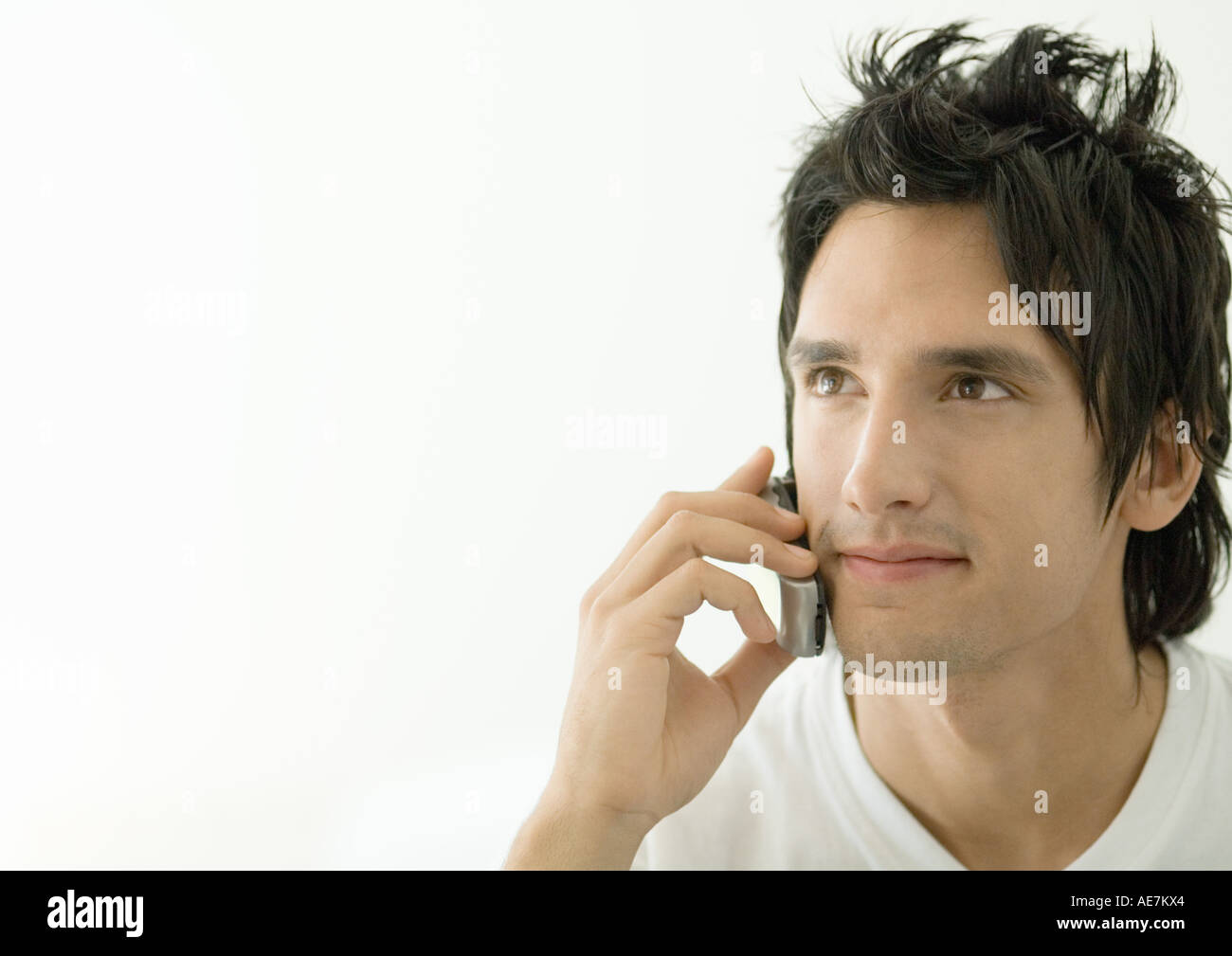 Young man using cell phone Stock Photo