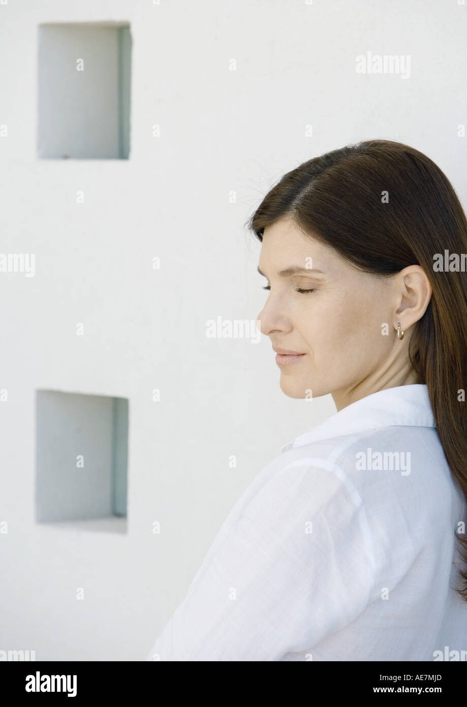 Woman with eyes closed, side view Stock Photo