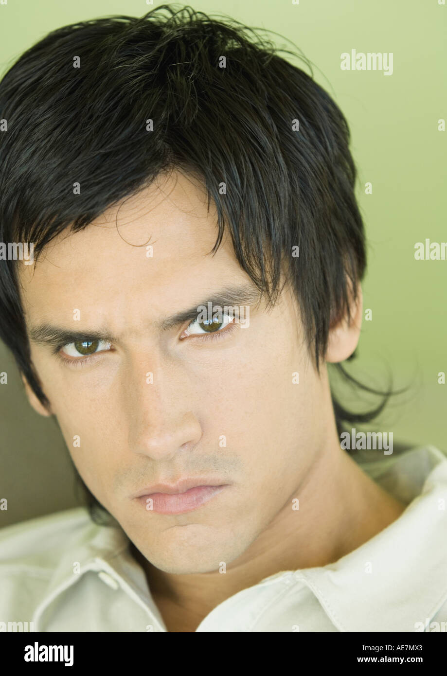 Young man frowning Stock Photo