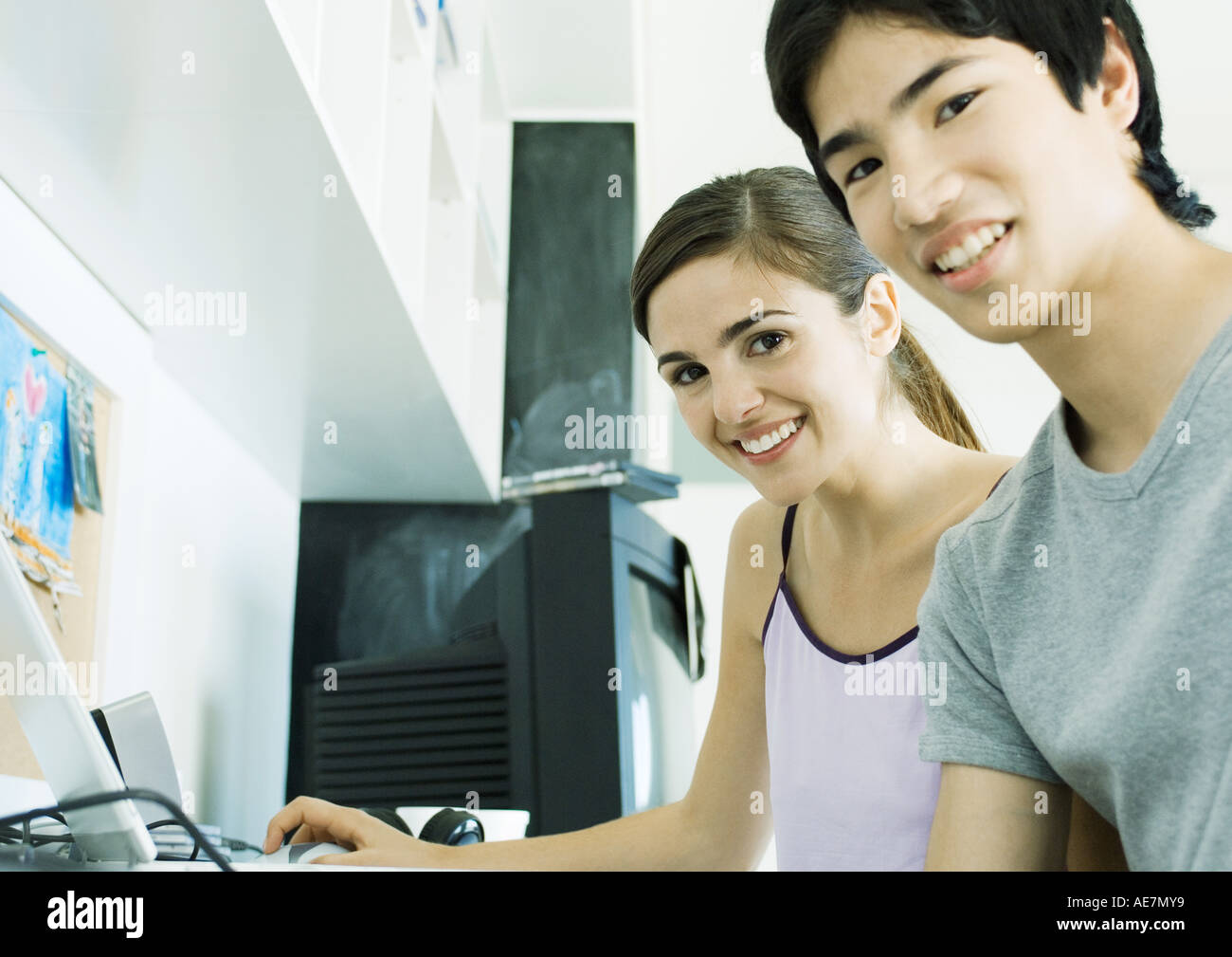 Young couple sitting at computer Stock Photo