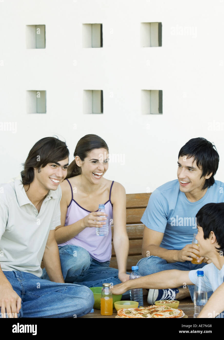 Group of young adult friends sharing meal Stock Photo