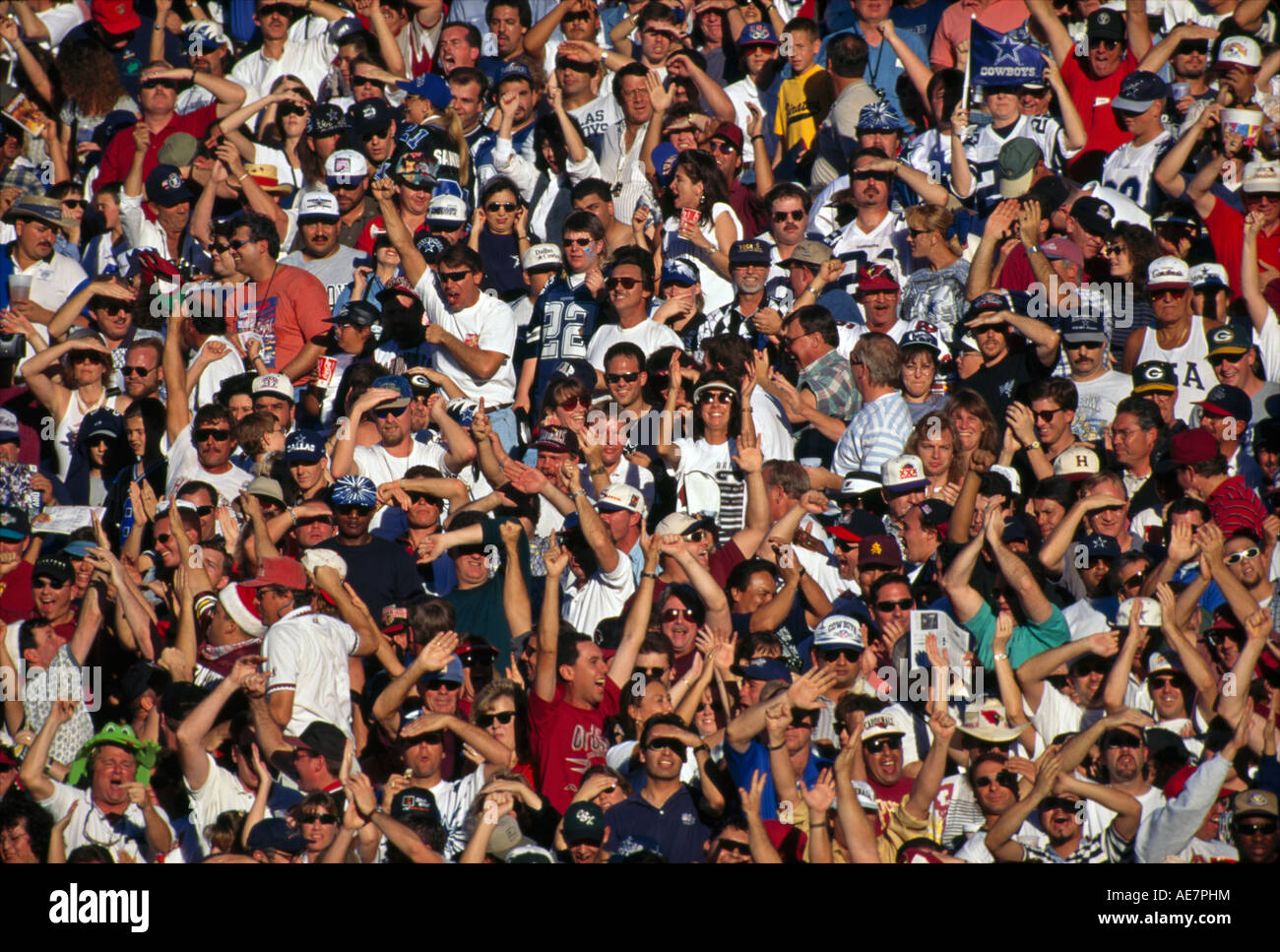 A crowd rejoices after a touchdown is scored in a game of American football in Tempe, Arizona Stock Photo