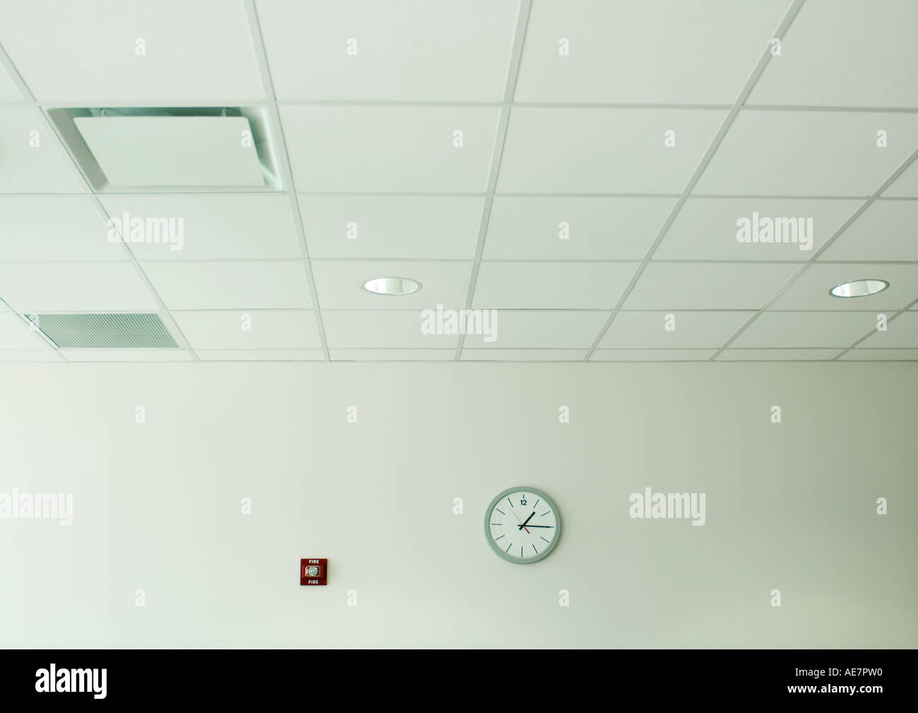 Clock on wall in office space Stock Photo Alamy